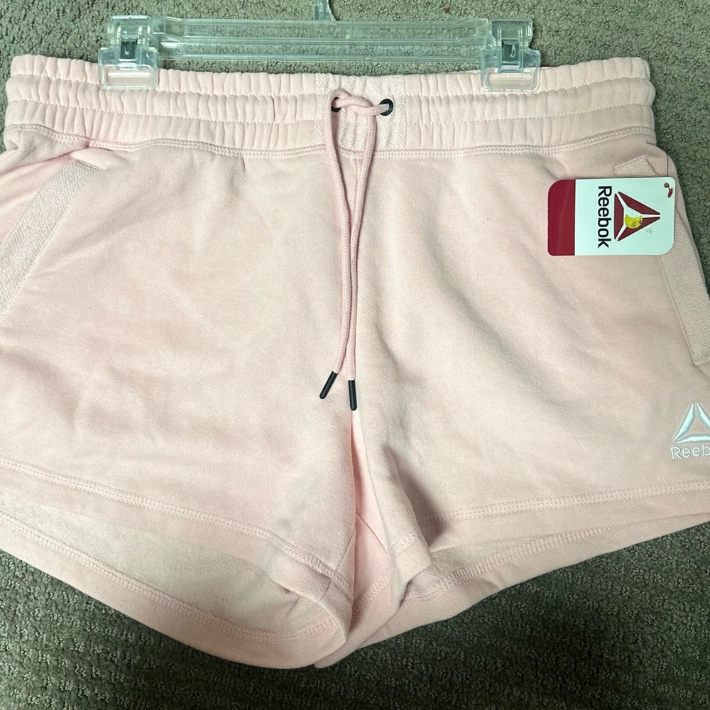 Reebok Soft Pink athletic shorts with pockets
